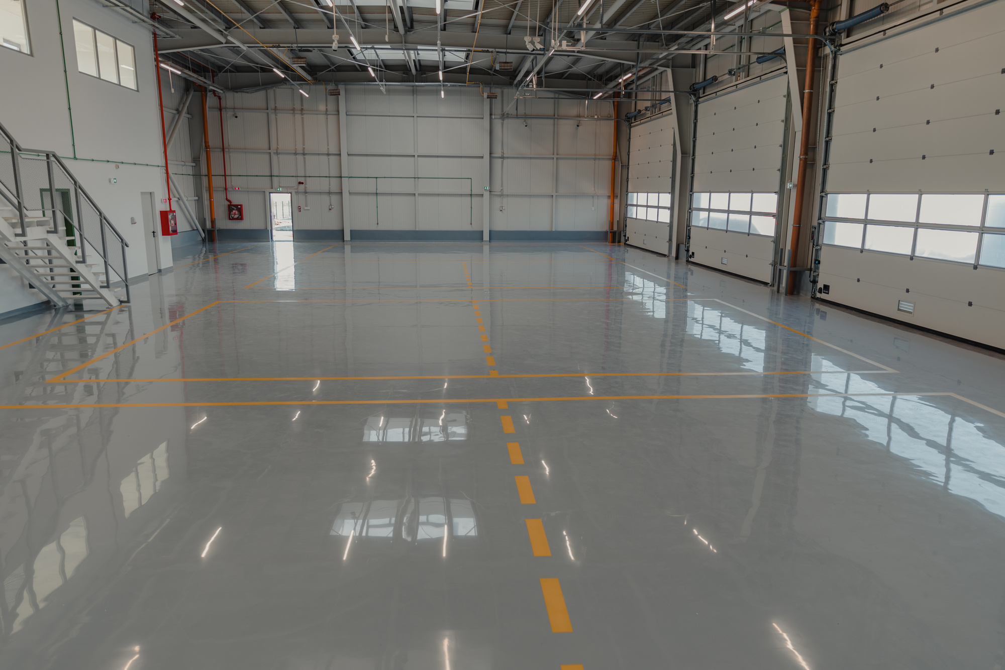 Epoxy and waxed flooring with colorful signage in car service